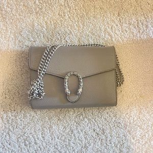 Gray Gucci crossbody bag